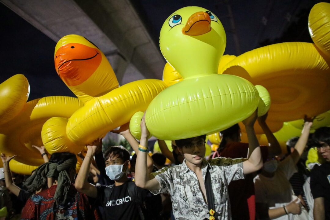 Protesters carry inflatable ducks during a pro-democracy rally demanding the prime minister to resign and reforms on the monarchy, at 11th Infantry Regiment, in Bangkok, Thailand, 29 November 2020 (Photo: Reuters/Soe Zeya Tun).