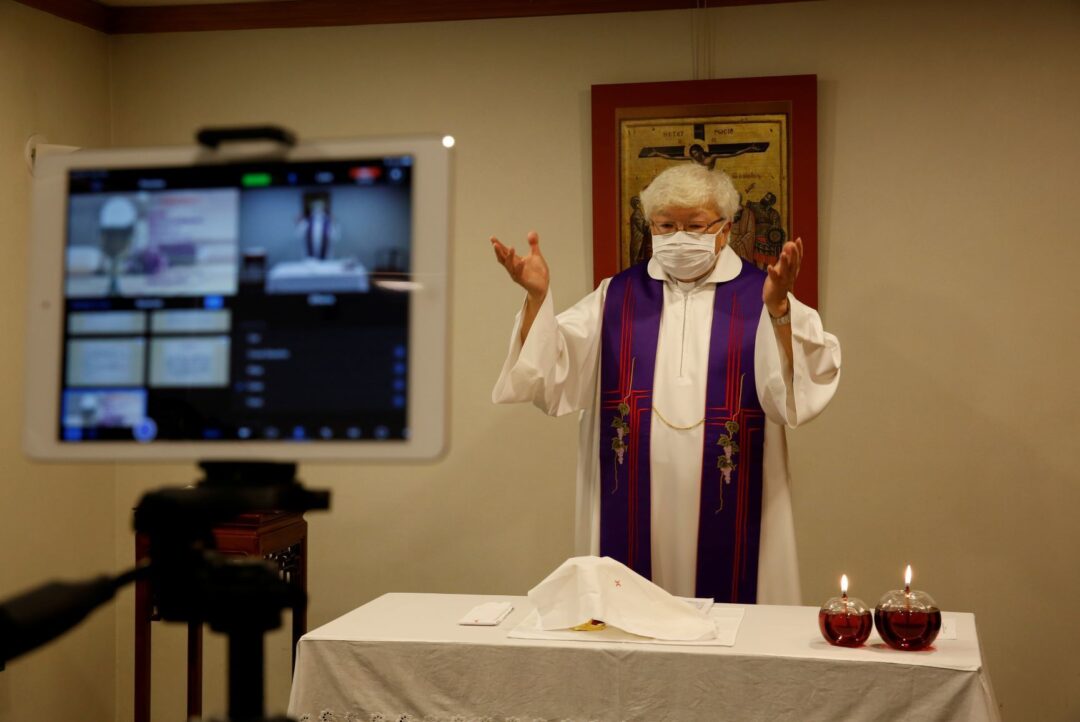 Thomas Law Kwok Fai, a priest, conducts Mass streamed online for people to mark the second Sunday of Lent, after the Roman Catholic Diocese of Hong Kong temporarily suspended public masses at churches, following the novel coronavirus disease (COVID-19) outbreak, in Hong Kong, China, 7 March 2020 (Photo: Reuters/Tyrone Siu).