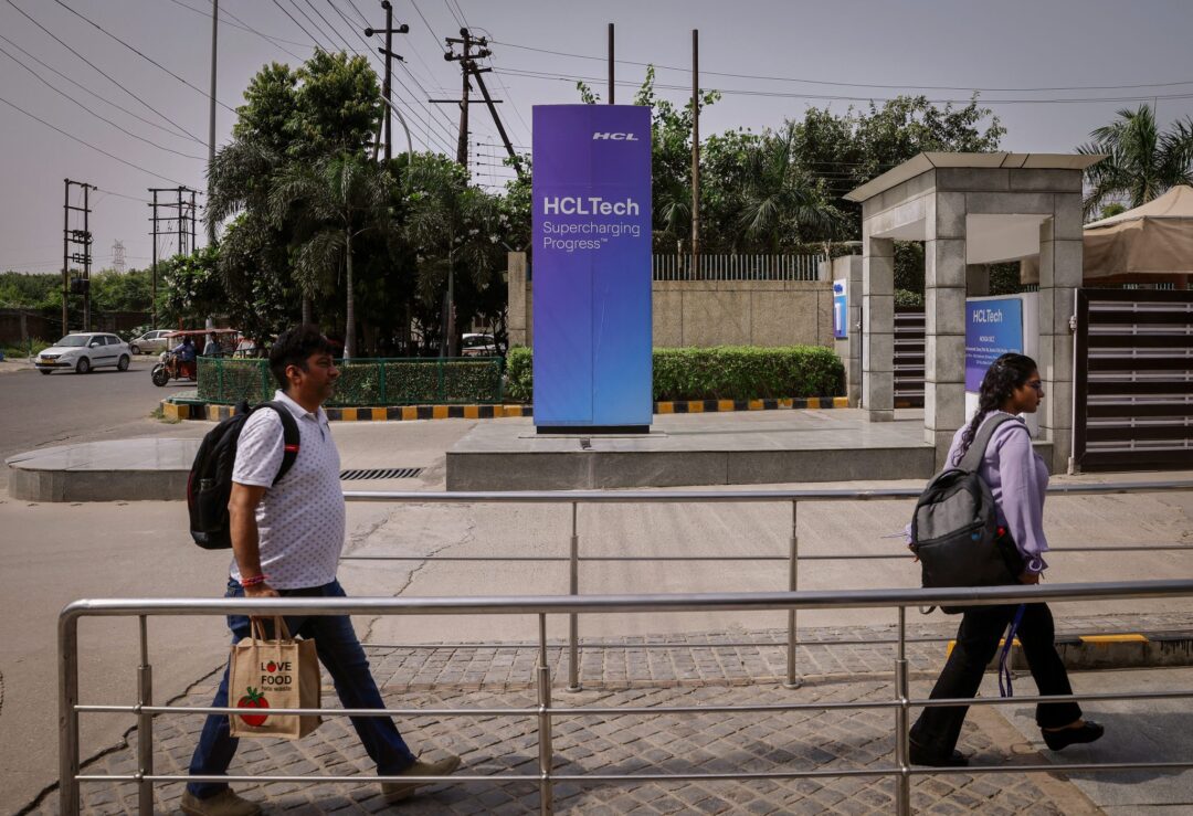 Employees arrive for work at HCL Technologies headquarters in Noida, on the outskirts of New Delhi, India, 28 August 2023 (Photo: Reuters/Adnan Abidi).